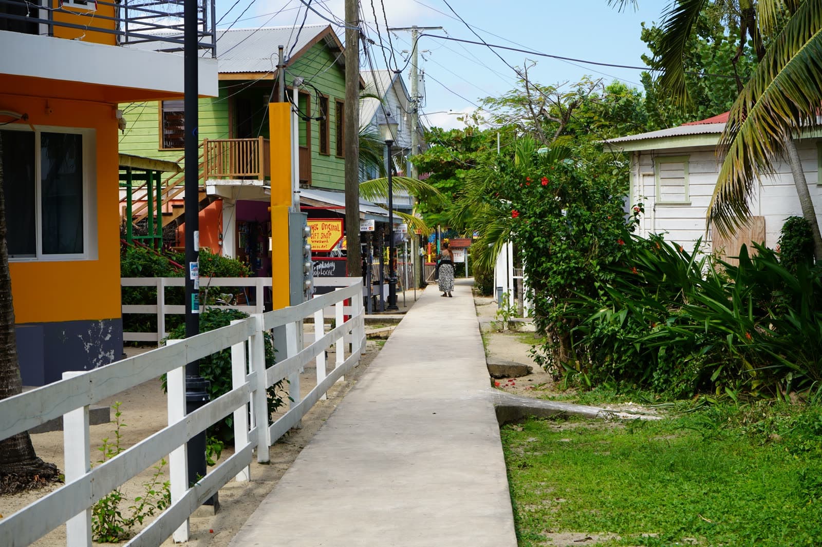 The Placencia sidewalk between colorful wooden houses