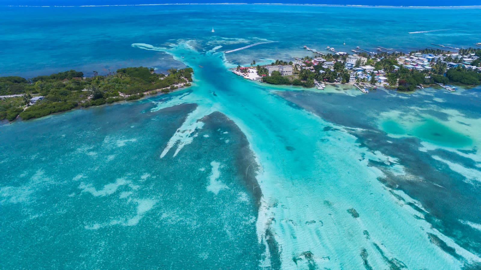Caye Caulker from above: the Split, turquoise shallows and the village
